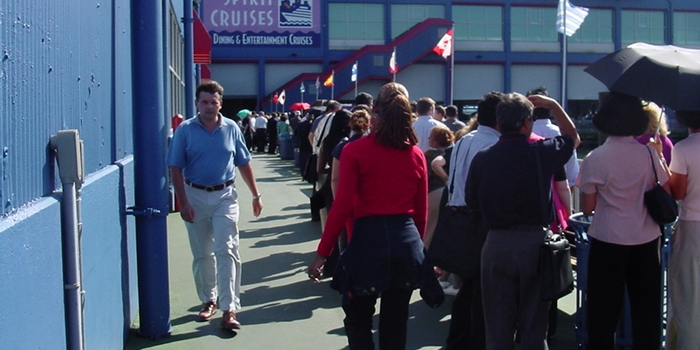 people lined up waiting to board Spirit Cruise